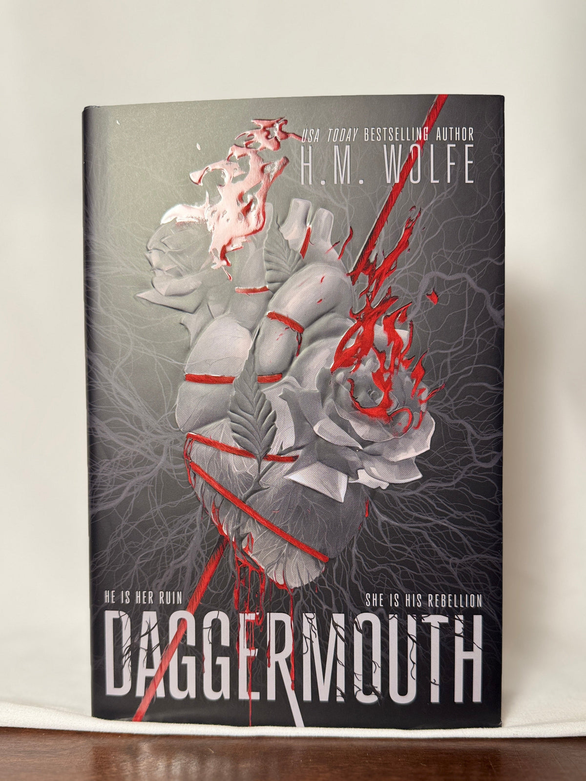 Cover of Daggermouth (The Heart Duology, Book 1) by H.M. Wolfe, First Printing Special Edition with Sprayed Edges