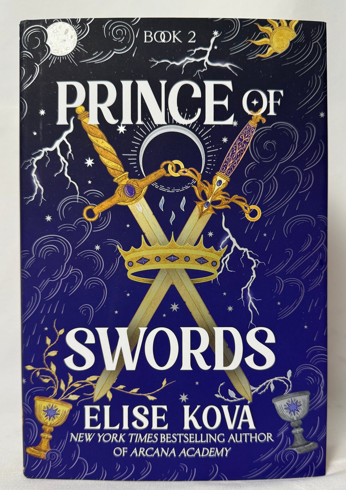Cover of Prince of Swords (Arcana Academy, Book 2) by Elise Kova, First Edition Hardcover with Sprayed Edges