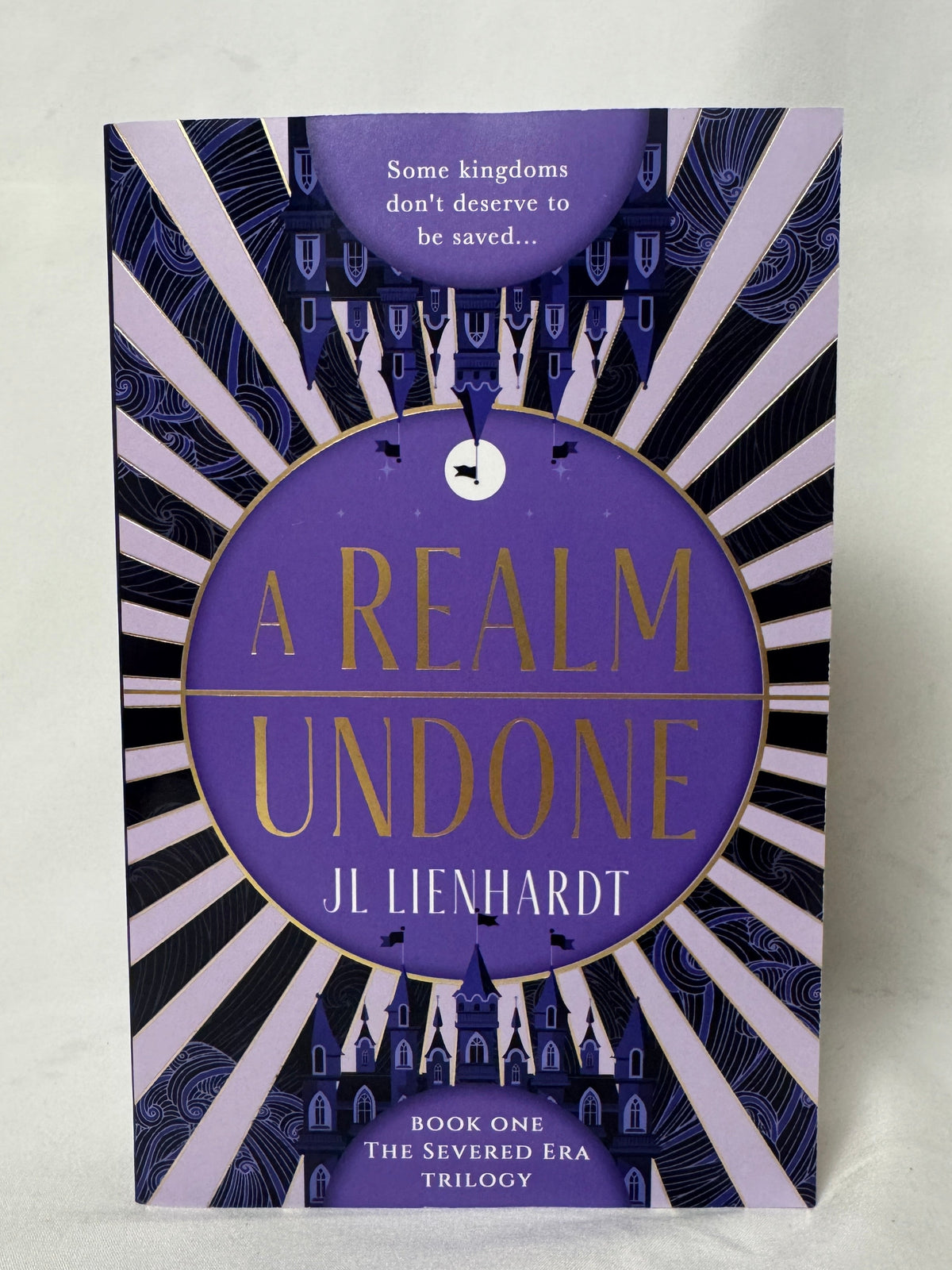 Cover of A Realm Undone (The Severed Era) by J.L. Lienhardt, Paperback