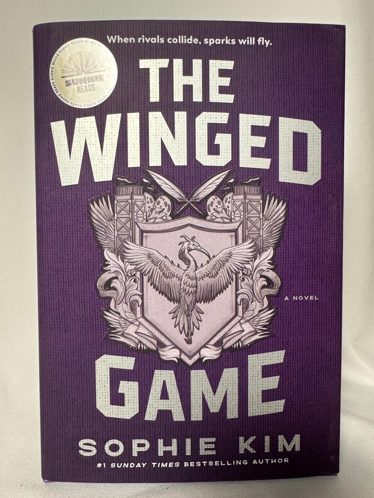 Cover of The Winged Game by Sophie Kim, First Edition Hardcover with Sprayed Edges